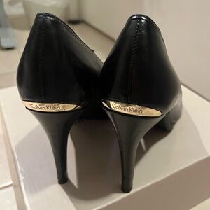 Calvin Klein Black Heels with Gold monogram tag
